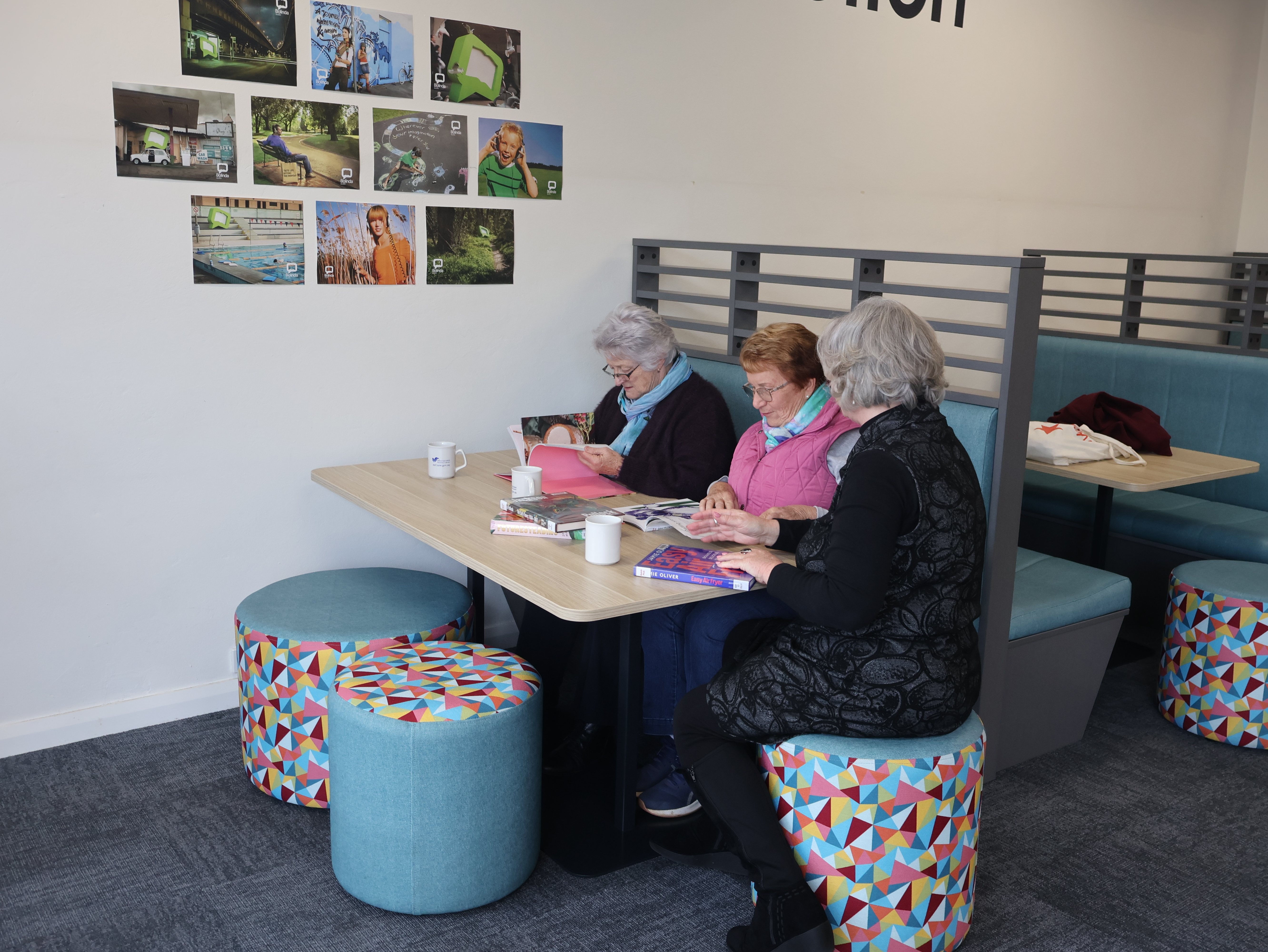 Three ladies sitting in booths Dubbo 
